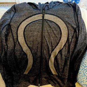 Women’s Lululemon dark grey zip-up jacket with hood, zip-up pockets